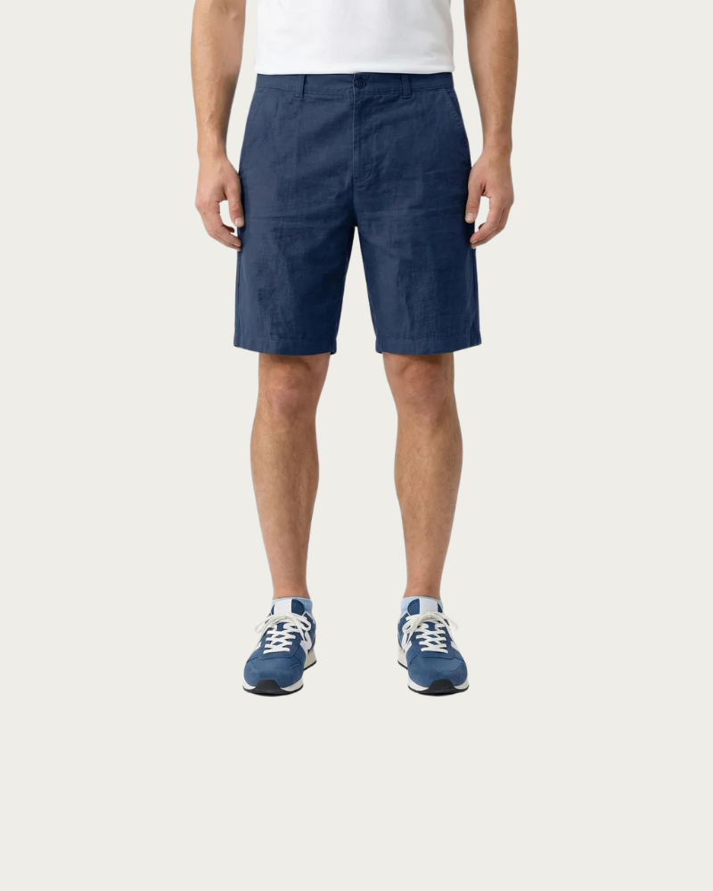 man wearing navy straight leg shorts front view relaxed fit