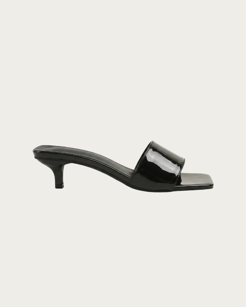 black kitten heel sandal side view low heel slip on style