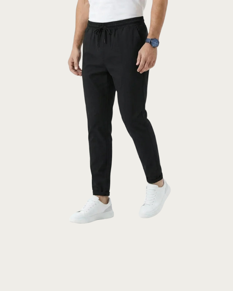 man wearing black stretch trousers front view minimal outfit