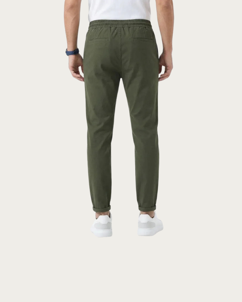 man wearing olive trousers back view tapered fit