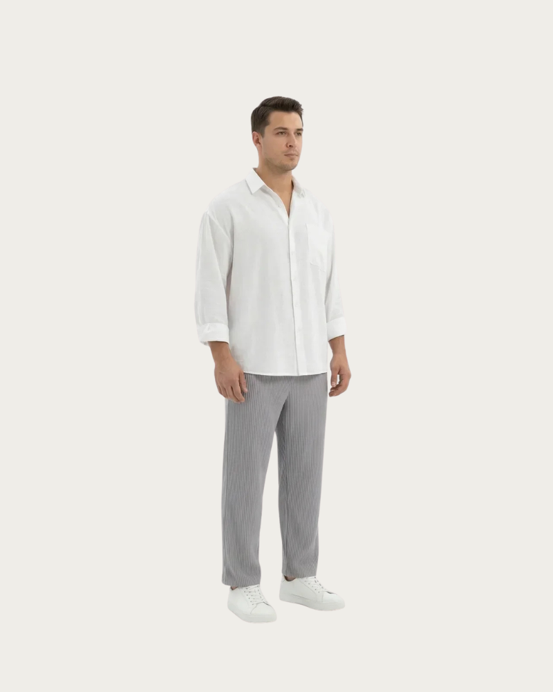 Man wearing grey wide leg trousers front view relaxed fit