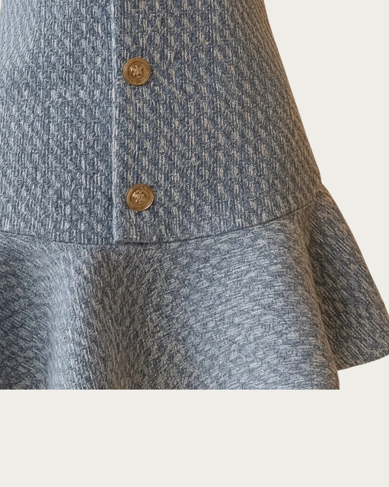 close up of blue tweed dress front buttons and fabric detail