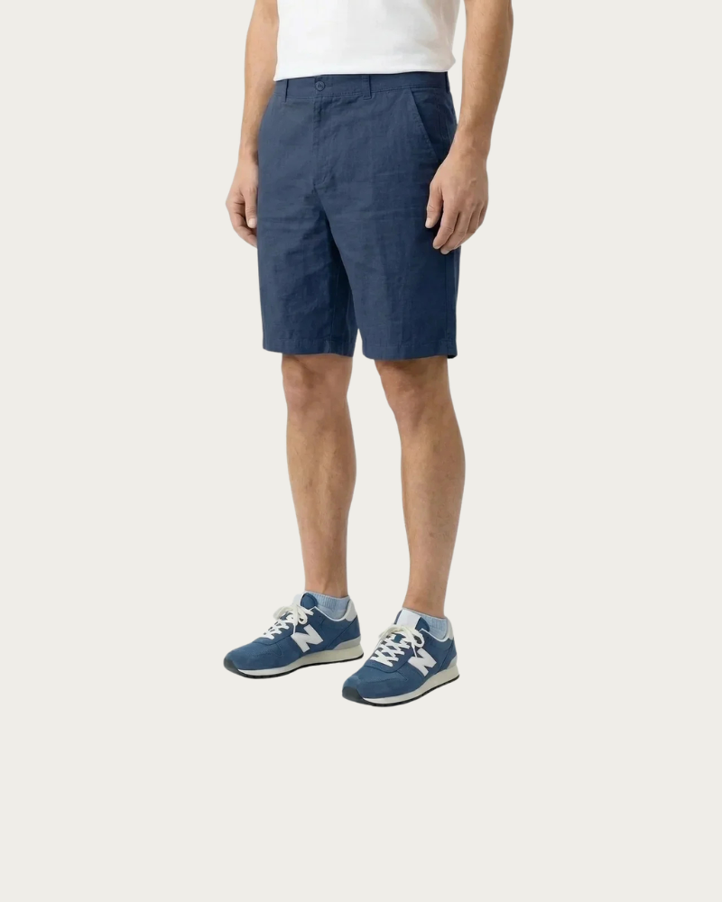 man wearing navy shorts side view casual summer outfit
