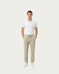 man wearing beige trousers full body casual summer outfit