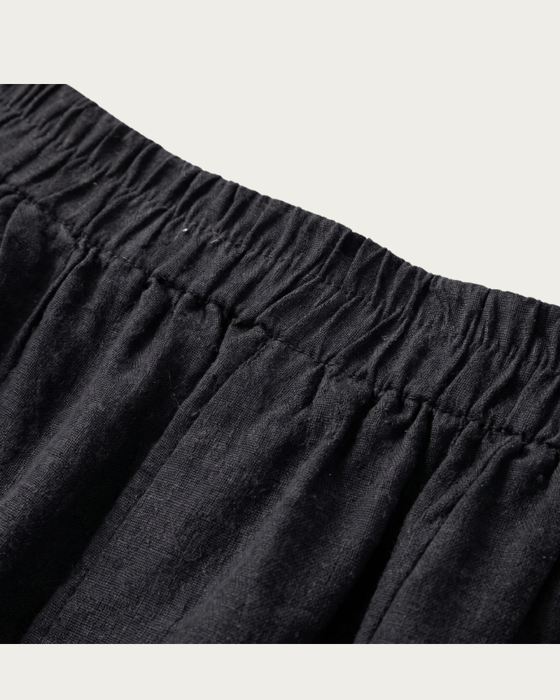 close up of black linen shorts elastic waistband detail