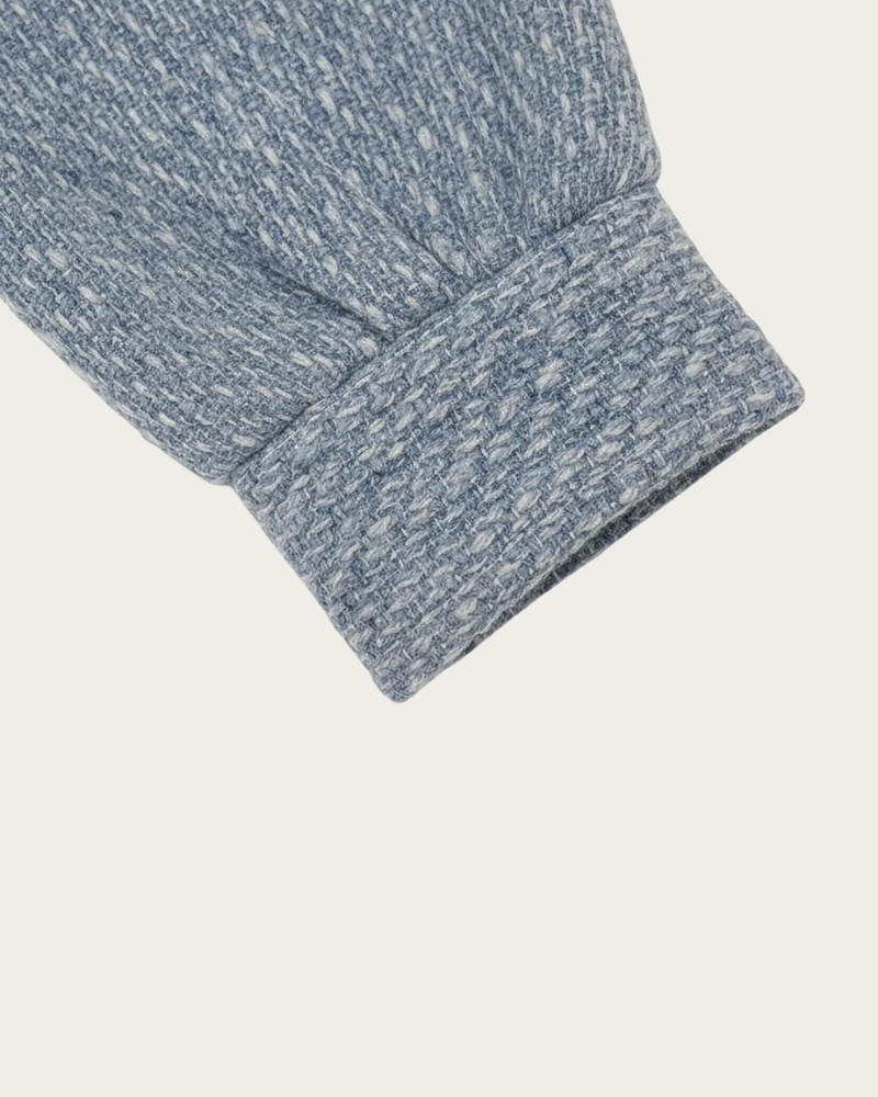 close up of blue tweed fabric texture folded material