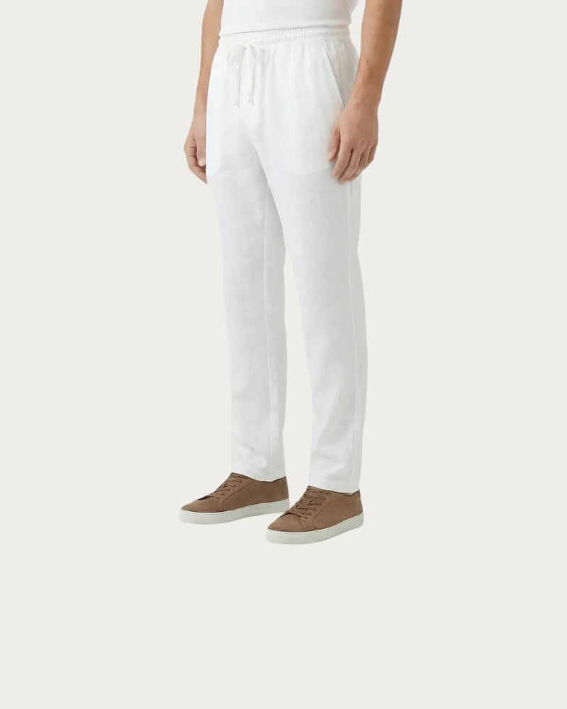 man wearing white linen trousers side view relaxed fit