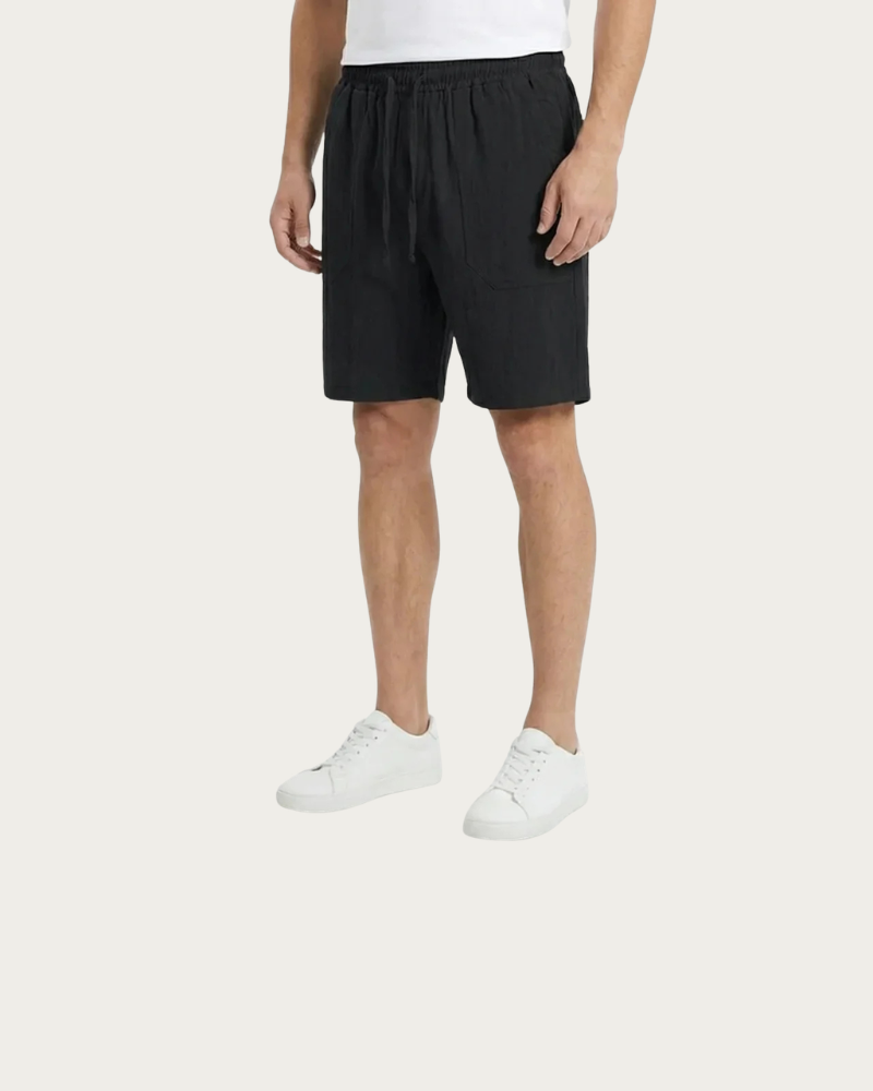 man wearing black linen shorts relaxed fit summer look