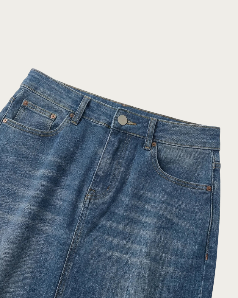 close up of blue denim skirt waistband and fabric detail