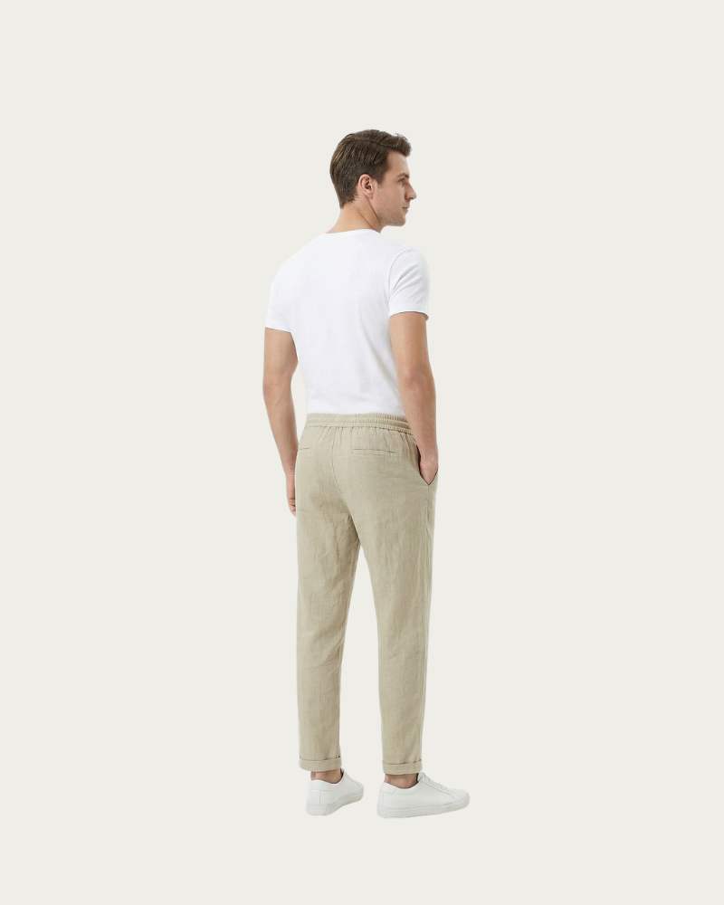 man wearing beige trousers back view relaxed fit
