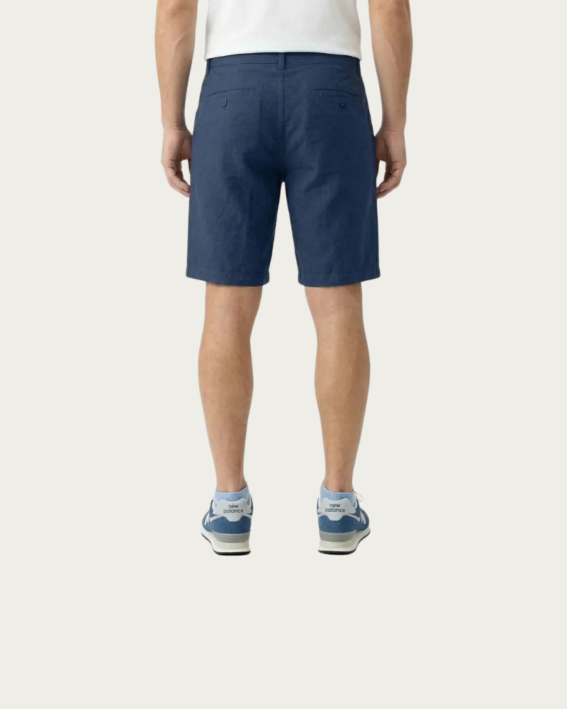 man wearing navy shorts back view relaxed fit