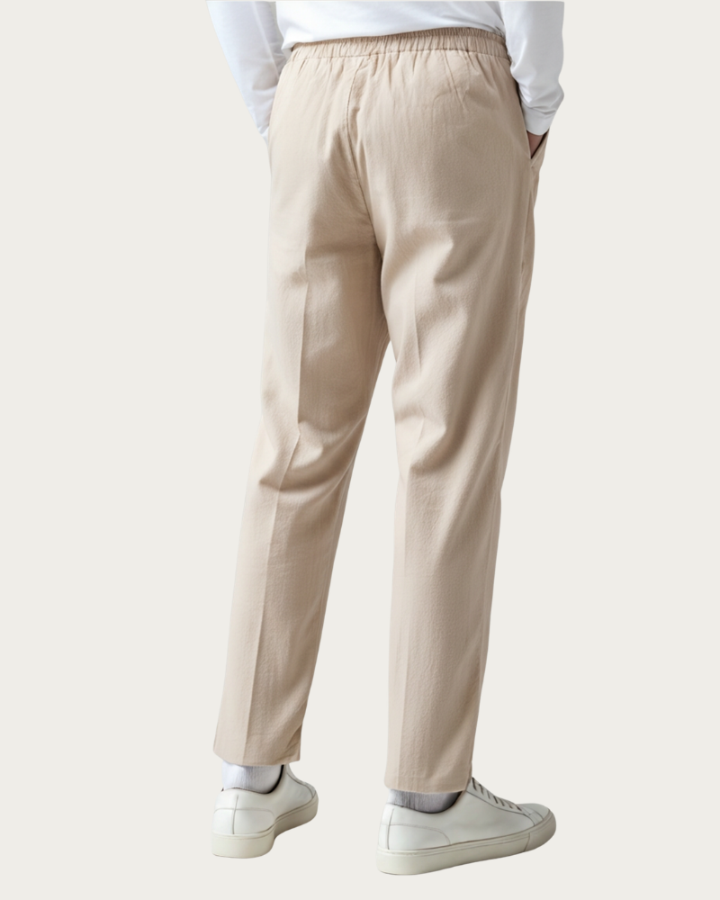 Man Wearing Beige Linen Trousers Side View Relaxed Fit