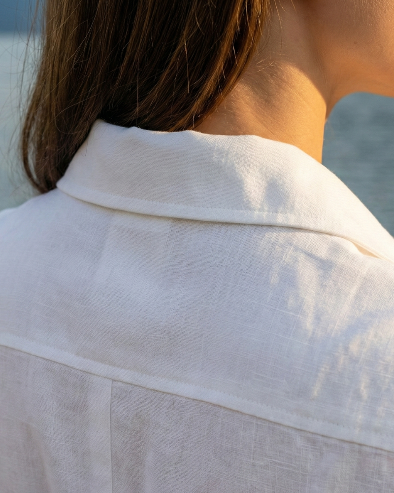Close Up Of White Shirt Dress Fabric And Sleeve Detail