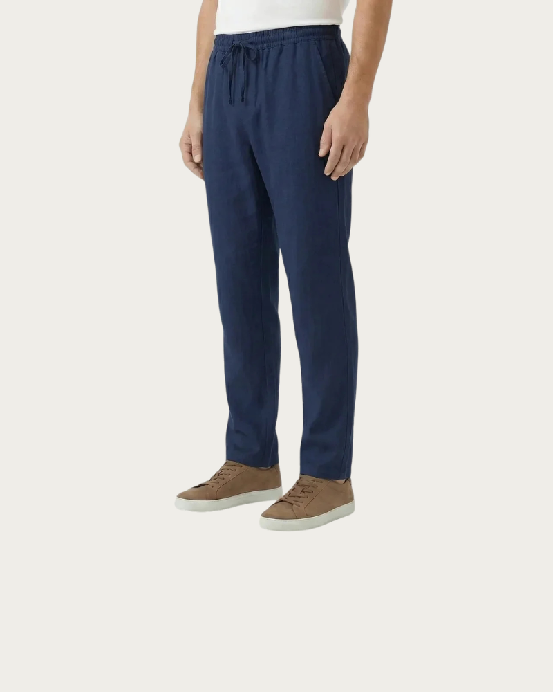 man wearing navy linen trousers relaxed fit summer look