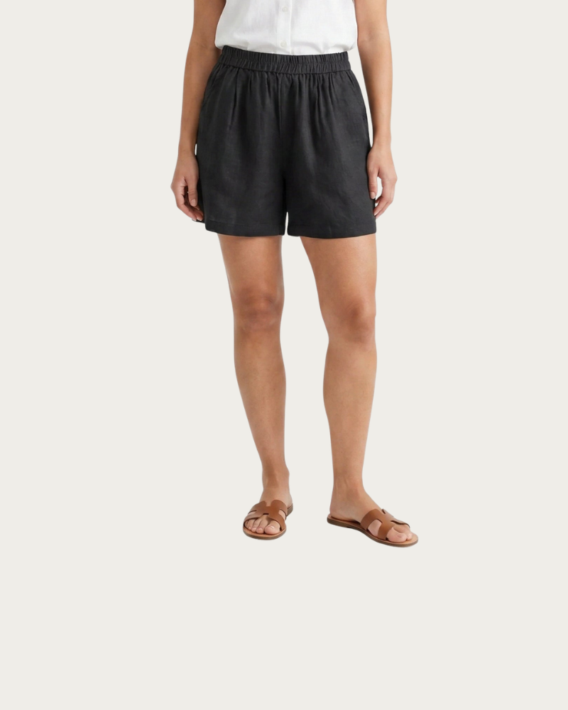 woman wearing black linen shorts front view casual look