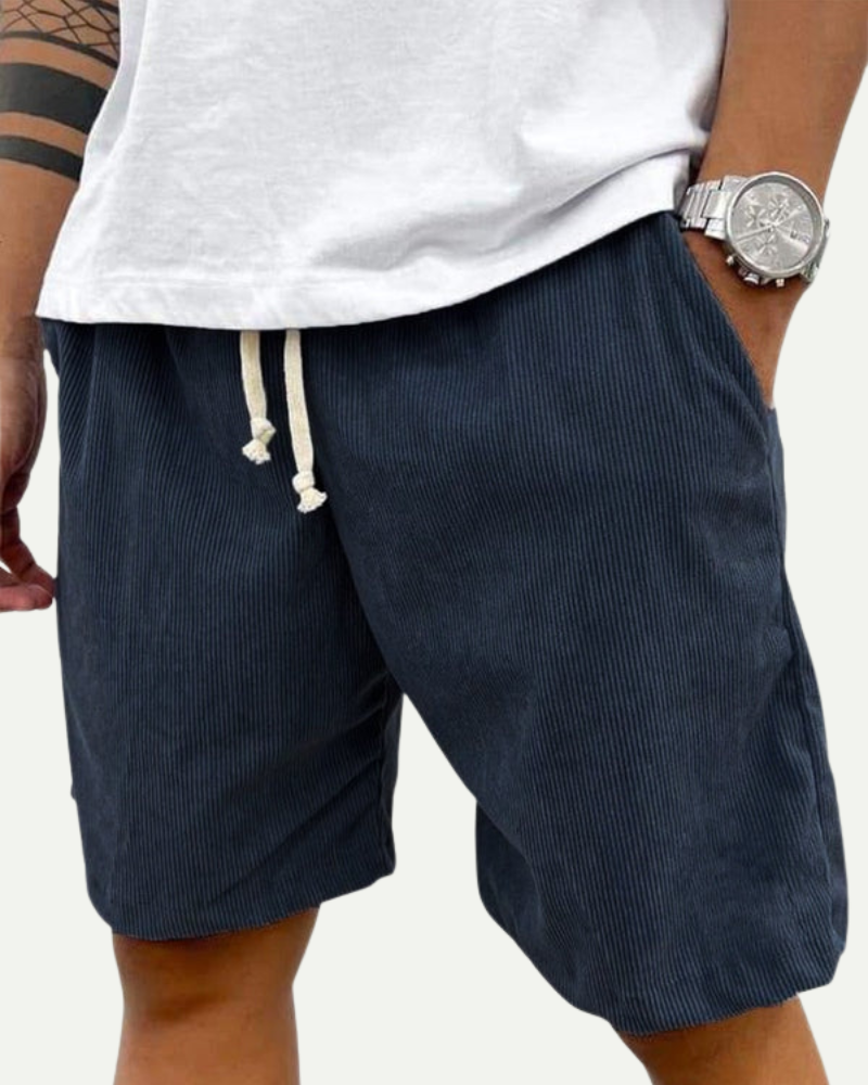 man wearing navy corduroy shorts front view relaxed fit