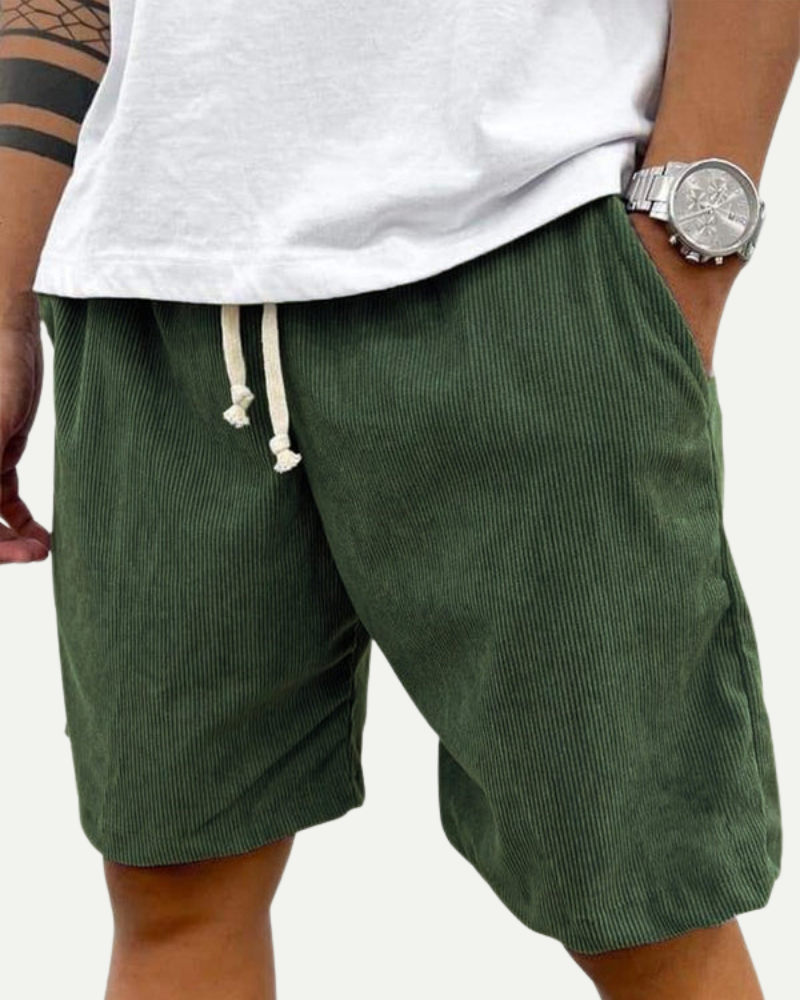 man wearing green corduroy shorts casual summer styling