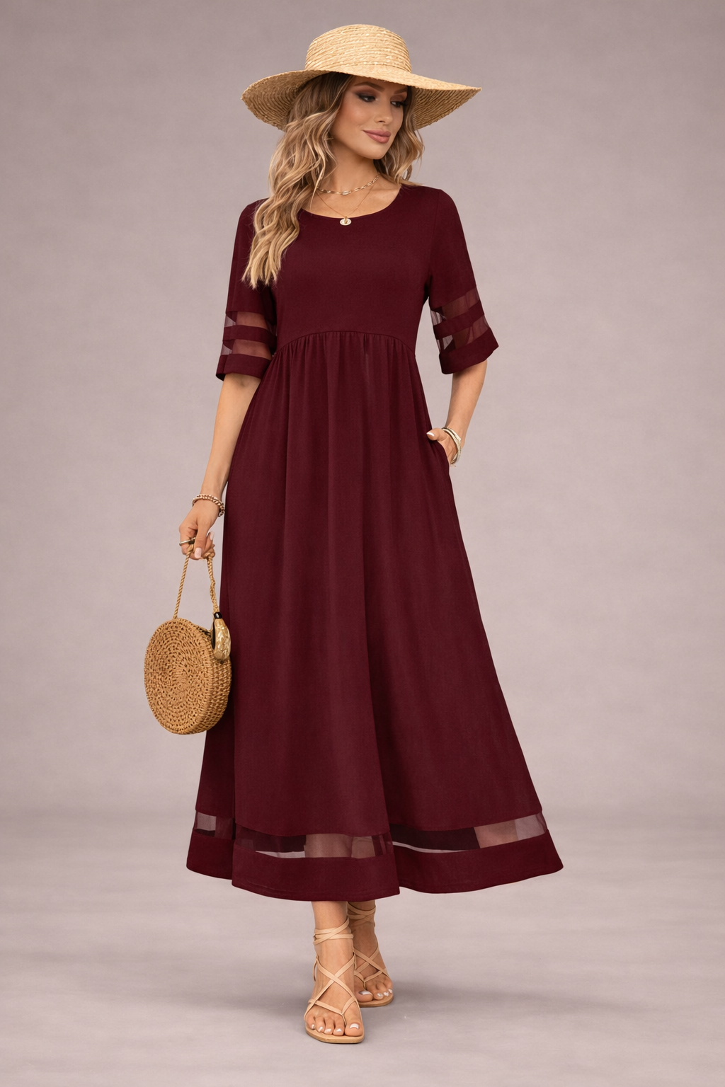 woman wearing burgundy maxi dress with hat casual elegant look