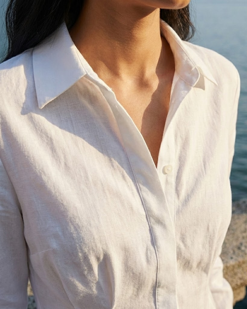Close Up Of White Shirt Dress Collar And Button Detail